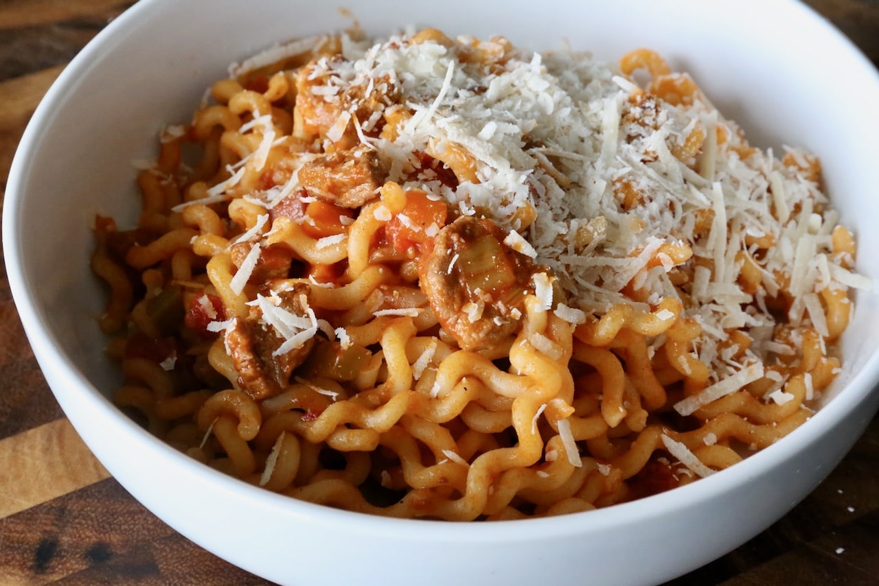 Serve Calabrese Pasta topped with Parmigiano Reggiano cheese. 