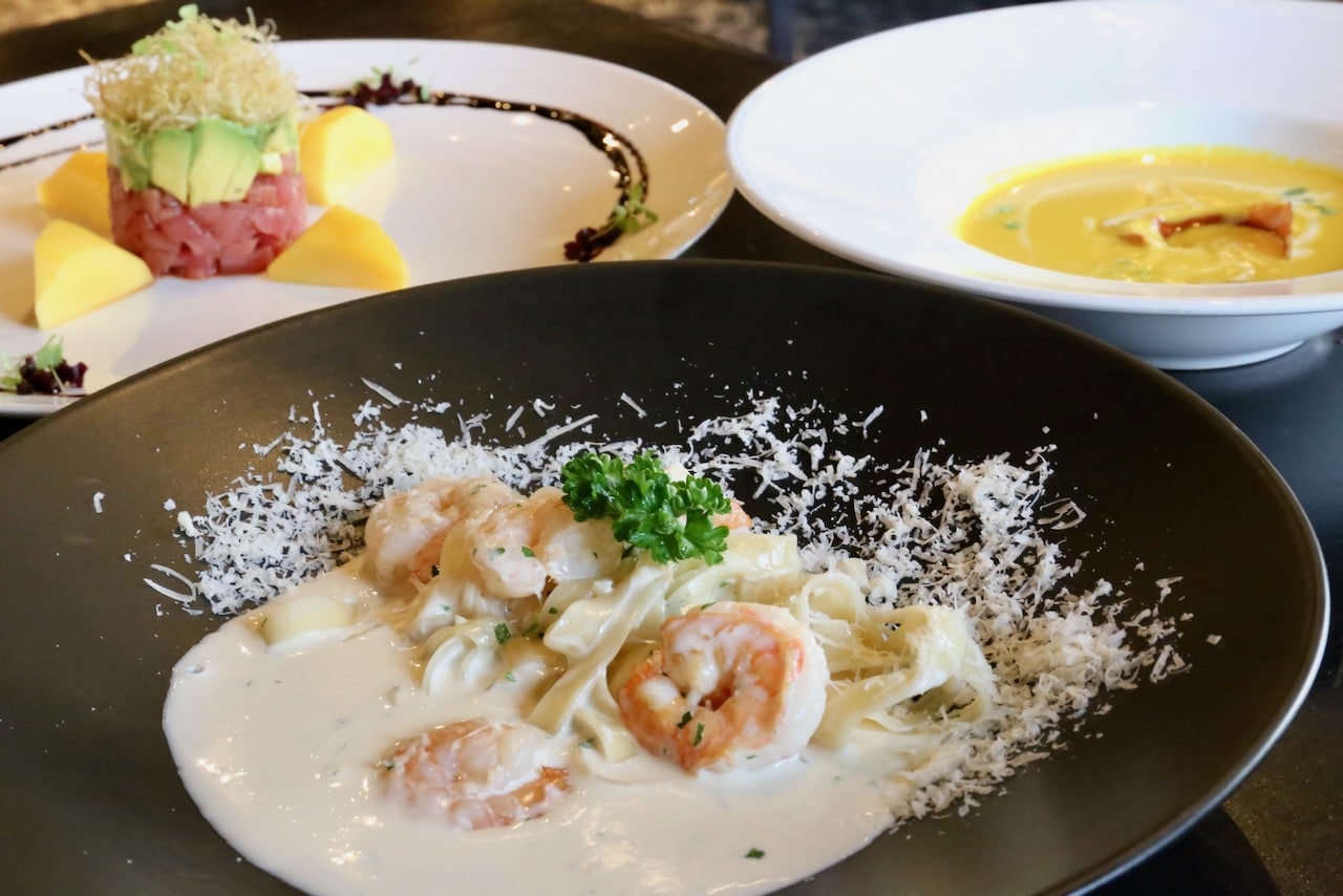 A sampling of dishes on the Palette menu featuring creamy prawn pasta, squash soup and tuna tartar. 