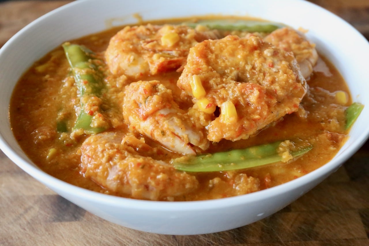 Gulai Udang is a Prawn Curry from Indonesia featuring snow peas, corn, and spicy chilies. 