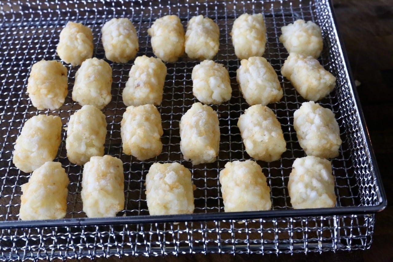 Place frozen tater tots into an air fryer basket, ensuring they do not touch. 