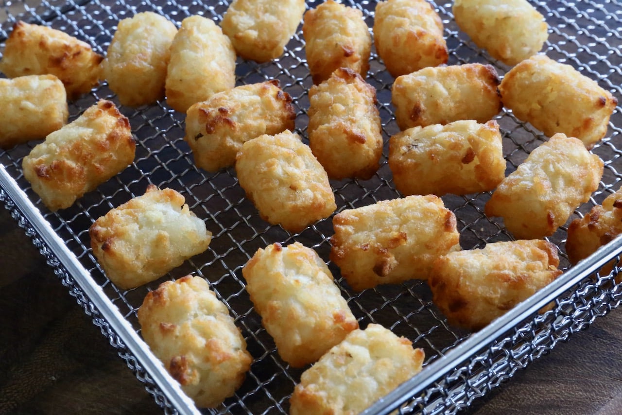 Frozen Tater Tots cooked in an air fryer are finished cooking once browned and crunchy. 