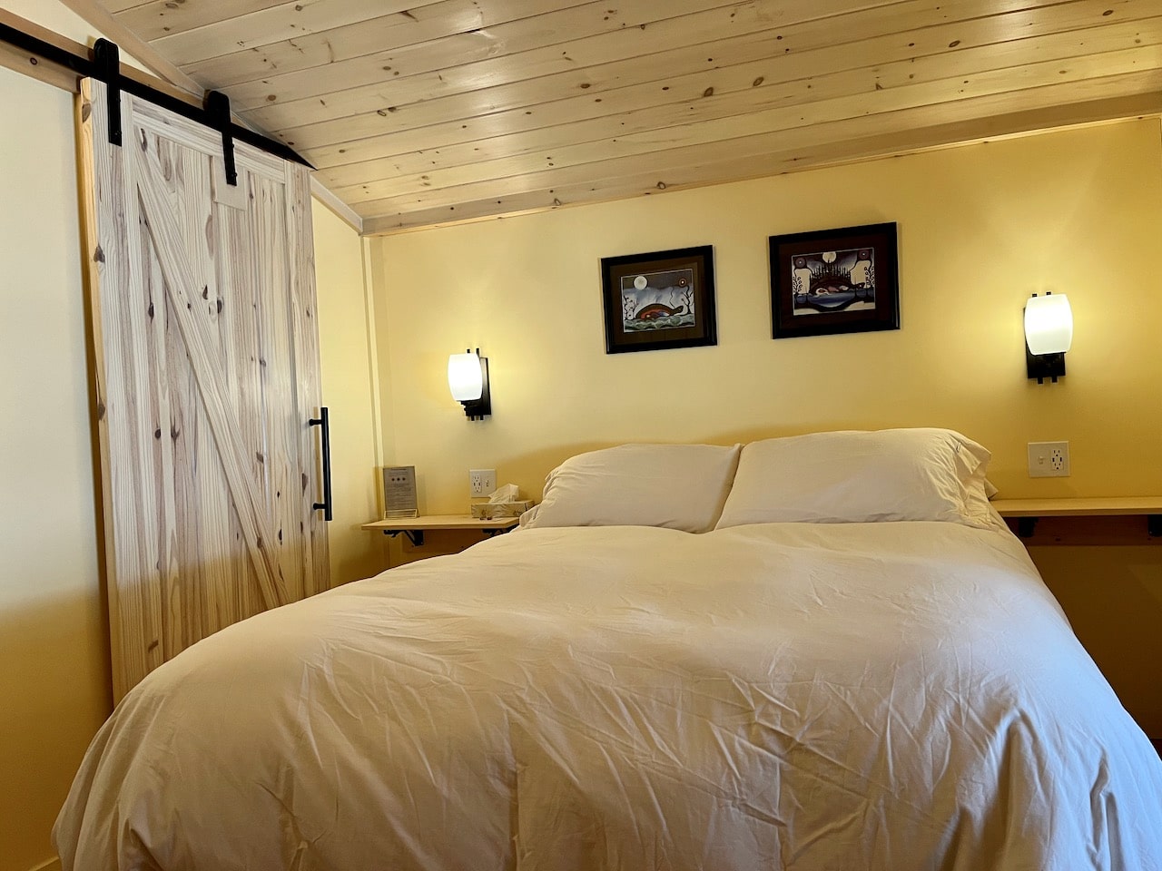 Northern Edge Algonquin's accommodations at Dreamer's Hill include cozy beds and a shared living room.