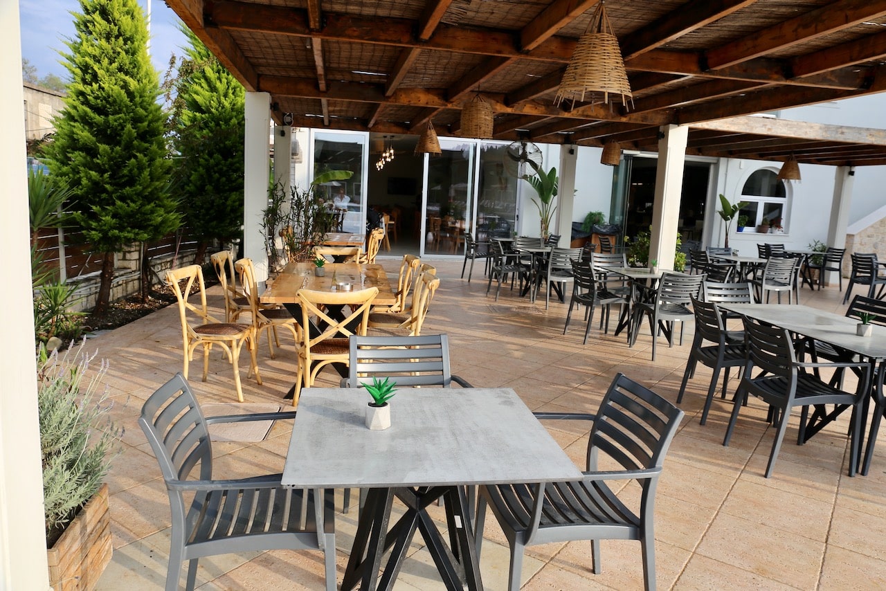 Enjoy dinner al fresco at the Ekati Mare Hotel patio.