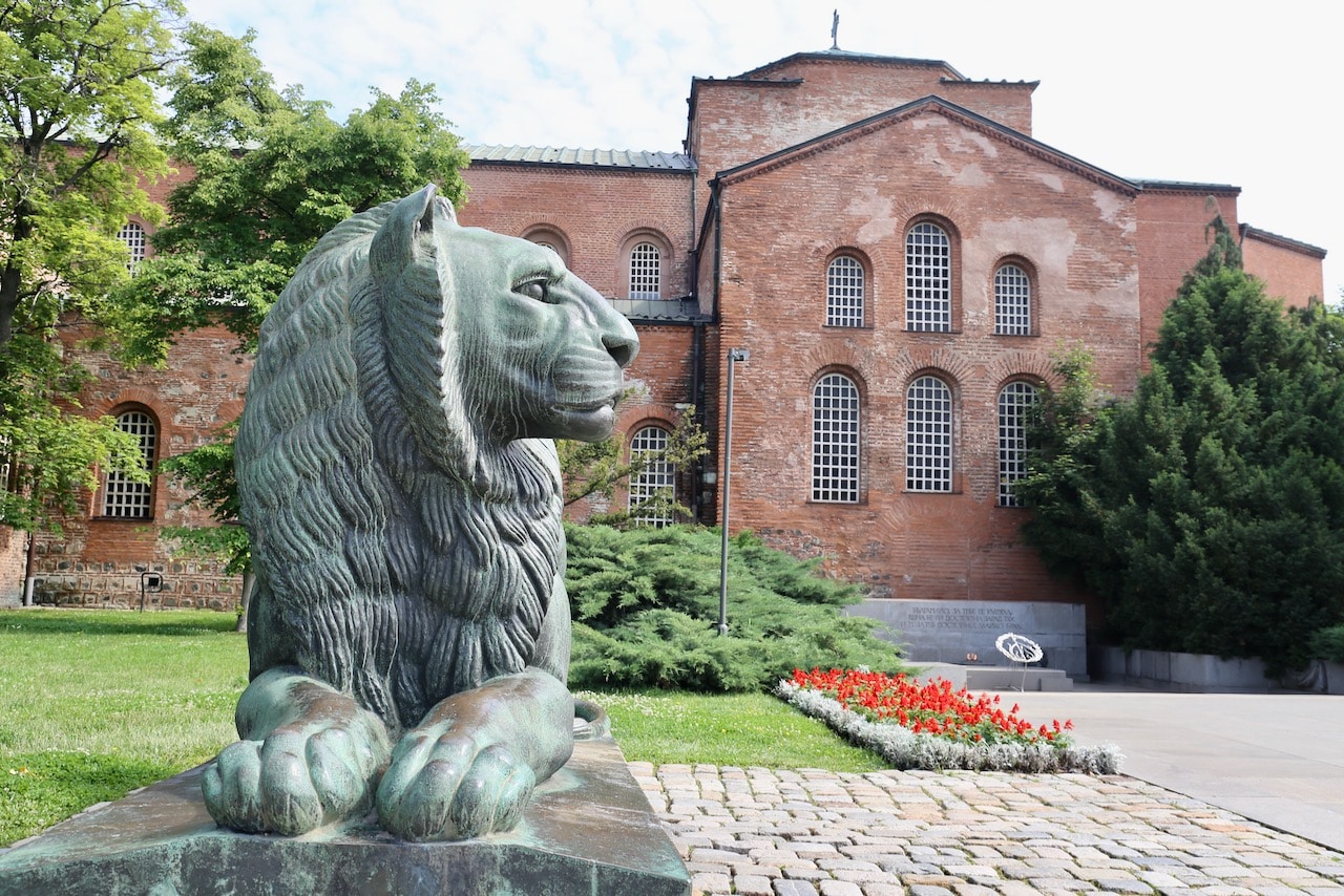 A lion statue sits in front of Saint Sofia Church in downtown Sofia.