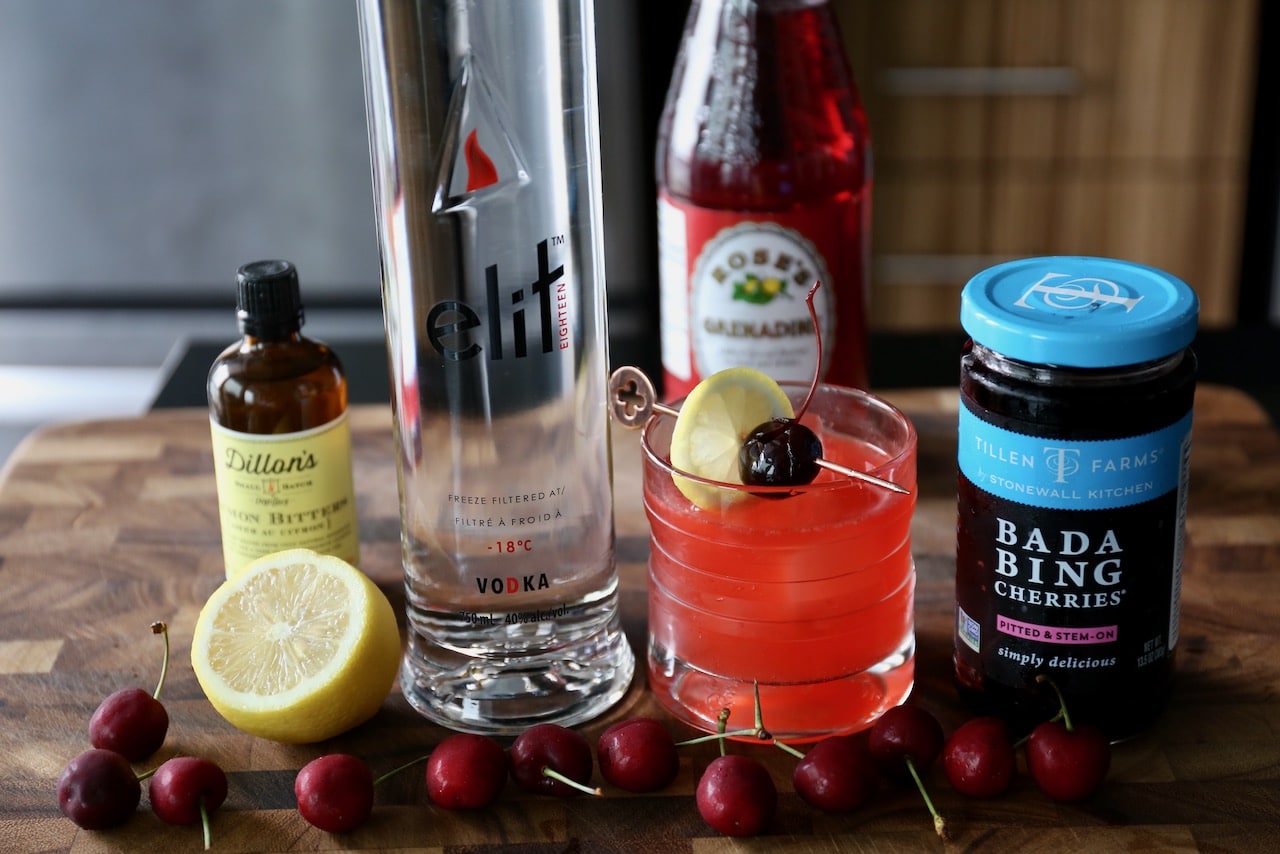 This Cherry Vodka Sour recipe features Stoli Elit, lemon juice, lemon bitters, syrup and maraschino cherries. 