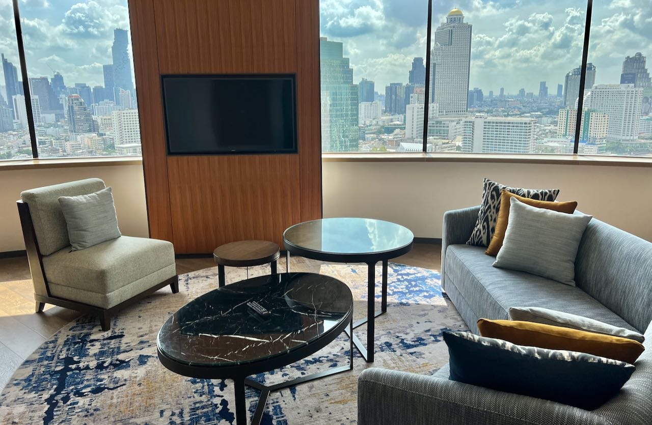 Executive suite living rooms offer panoramic views of the city and river below. 