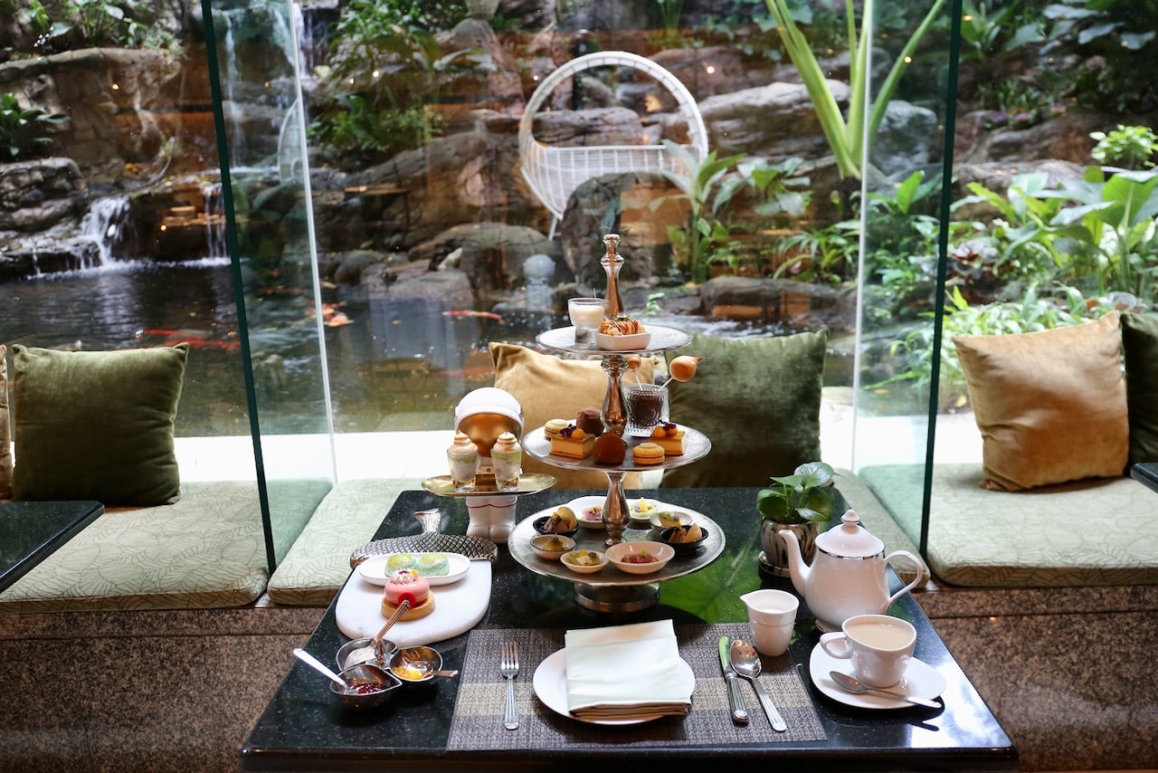 Enjoy afternoon tea at Bangkok Tree Bangkok while overlooking a koi pond and waterfall wrapped in tropical garden.