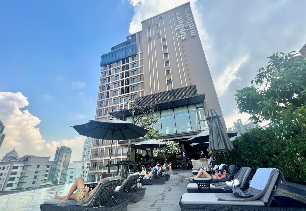 Sindhorn Midtown Hotel in Bangkok features a rooftop infinity pool with a cocktail bar.