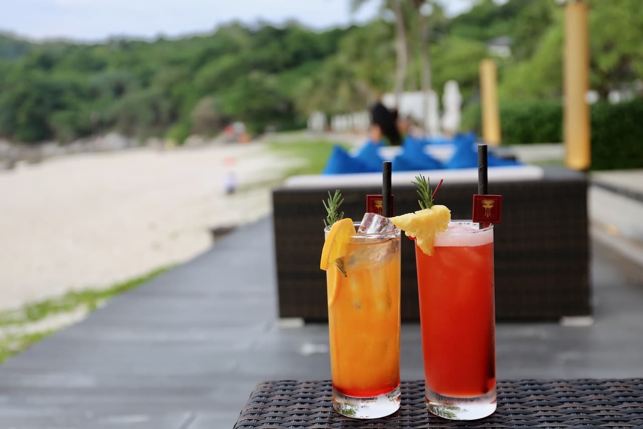 Sip tropical cocktails during sunset happy hour at Lobby Bar.