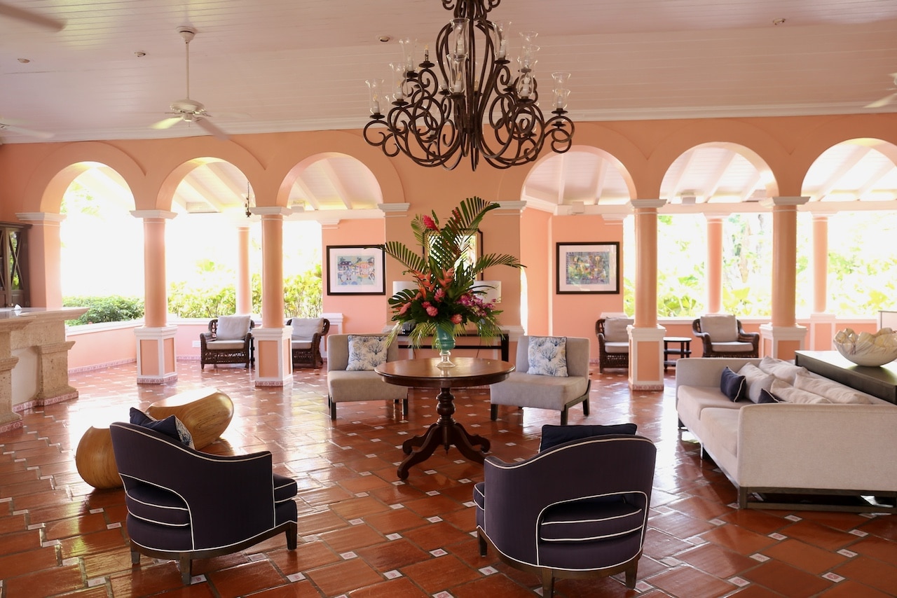 Guests check in and enjoy a welcome drink in the Fairmont Royal Pavilion lobby.