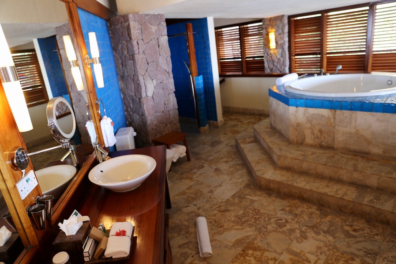Bathrooms are outfitted with a rain shower and elevated jacuzzi tub.